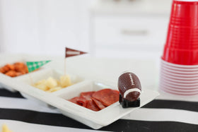 Nora Fleming mini-football on a ceramic base enhances shelf, desk, or entryway décor.