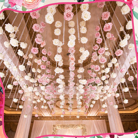 Norme crystal rose garland arranged along a staircase for festive ambiance.