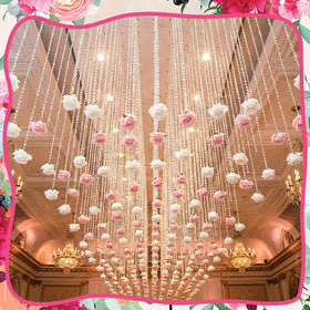 Norme rose crystal garland hanging on wall for elegant room decor.