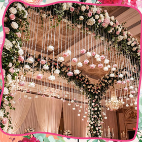 Norme crystal rose garland used as a wedding backdrop to elevate photos.
