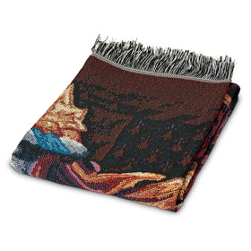Northwest Gryffindor Shield tapestry throw folded on bed for warm ambiance.