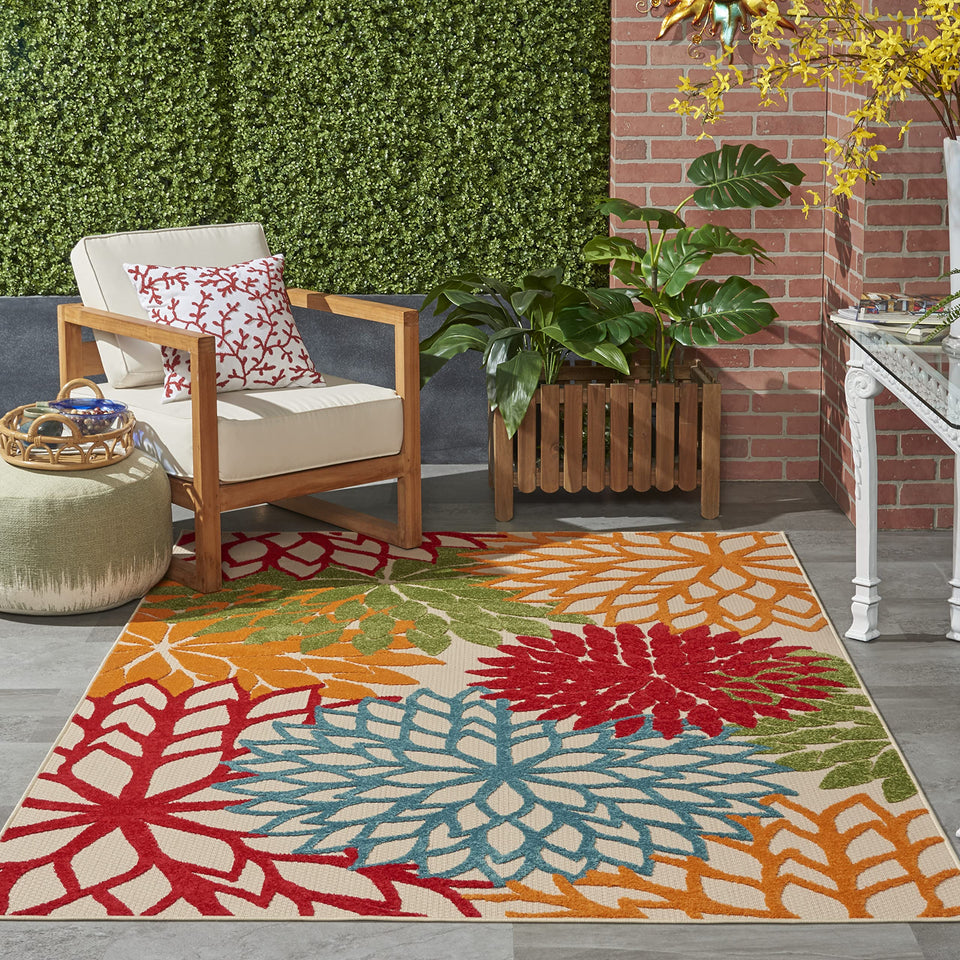 Nourison Aloha green floral design rug adds tropical style to indoor or outdoor spaces.