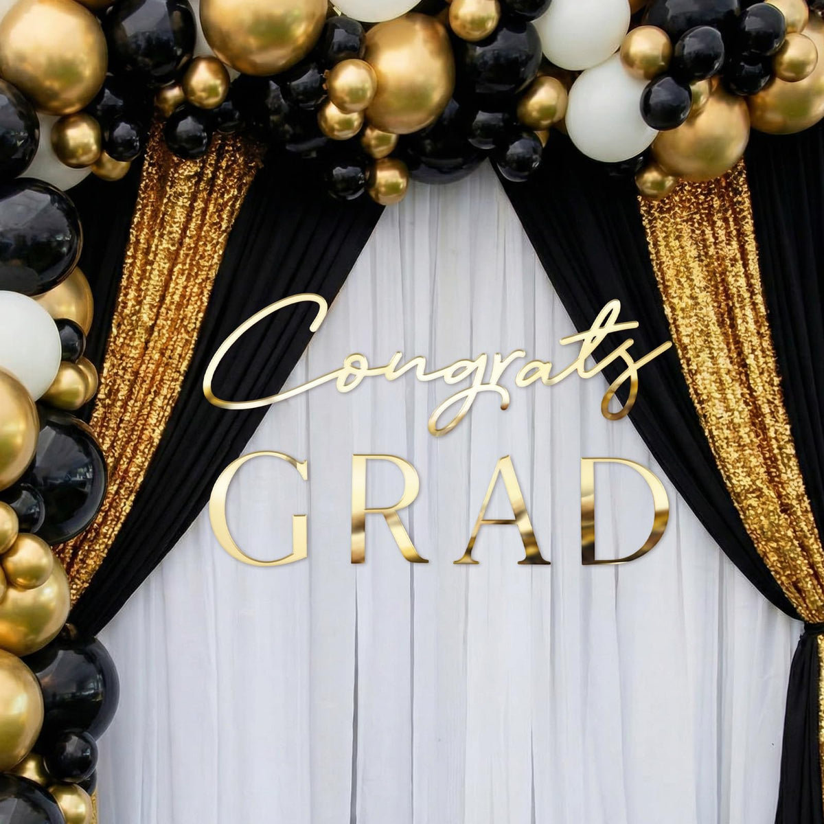 Novabright graduation decor attracts attention with gold lettering and shine.