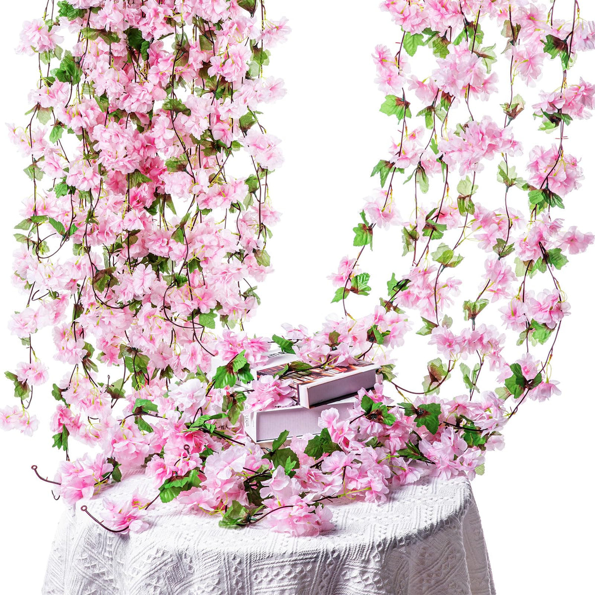 Nuenen cherry blossom vines pink closeup shows silk petals and green leaves detail.