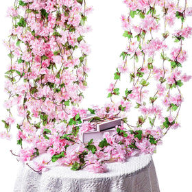 Nuenen cherry blossom vines pink closeup shows silk petals and green leaves detail.