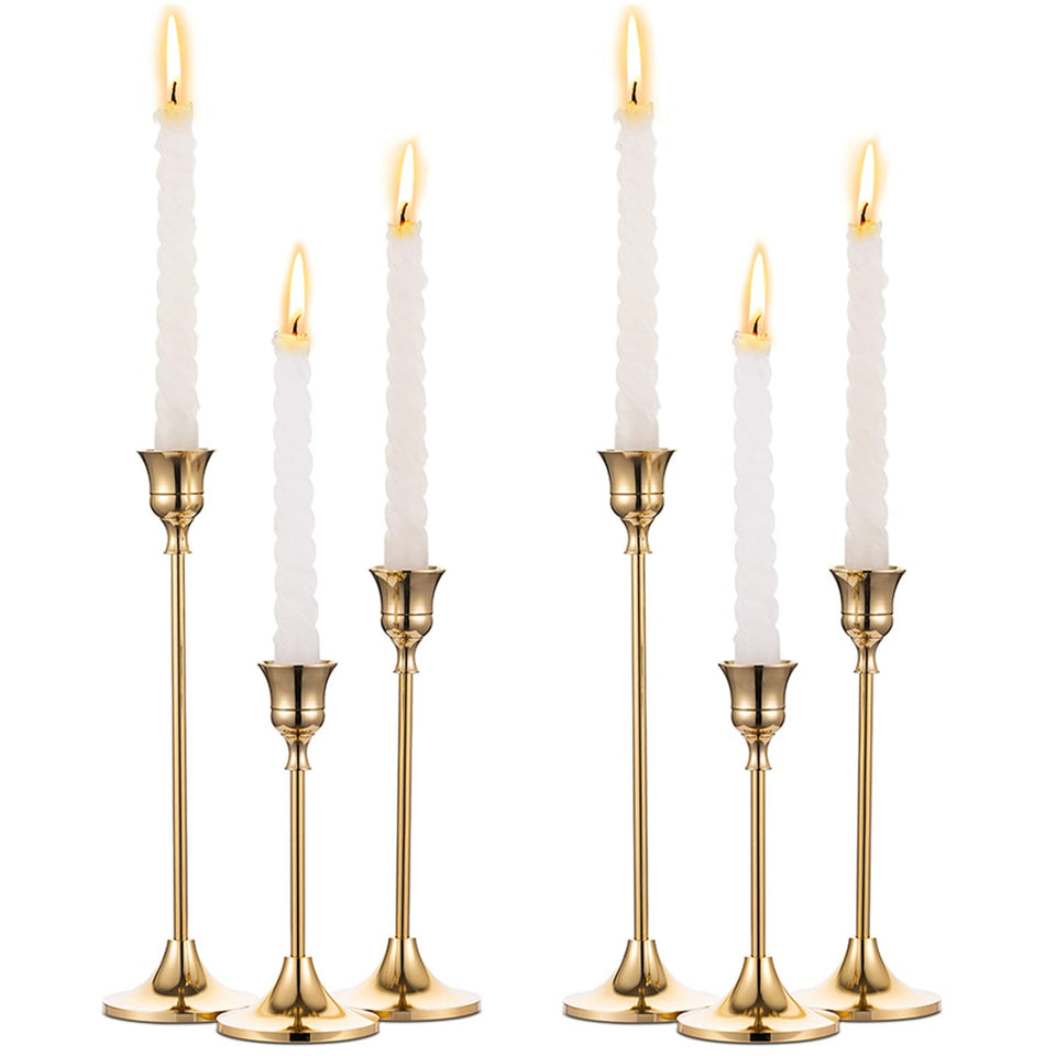NUPTIO brass gold taper candle holders arranged as a centerpiece for a sophisticated dining table.