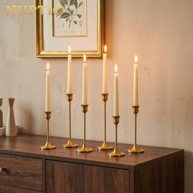 NUPTIO taper candle holders close-up showing brushed finish and premium craftsmanship.