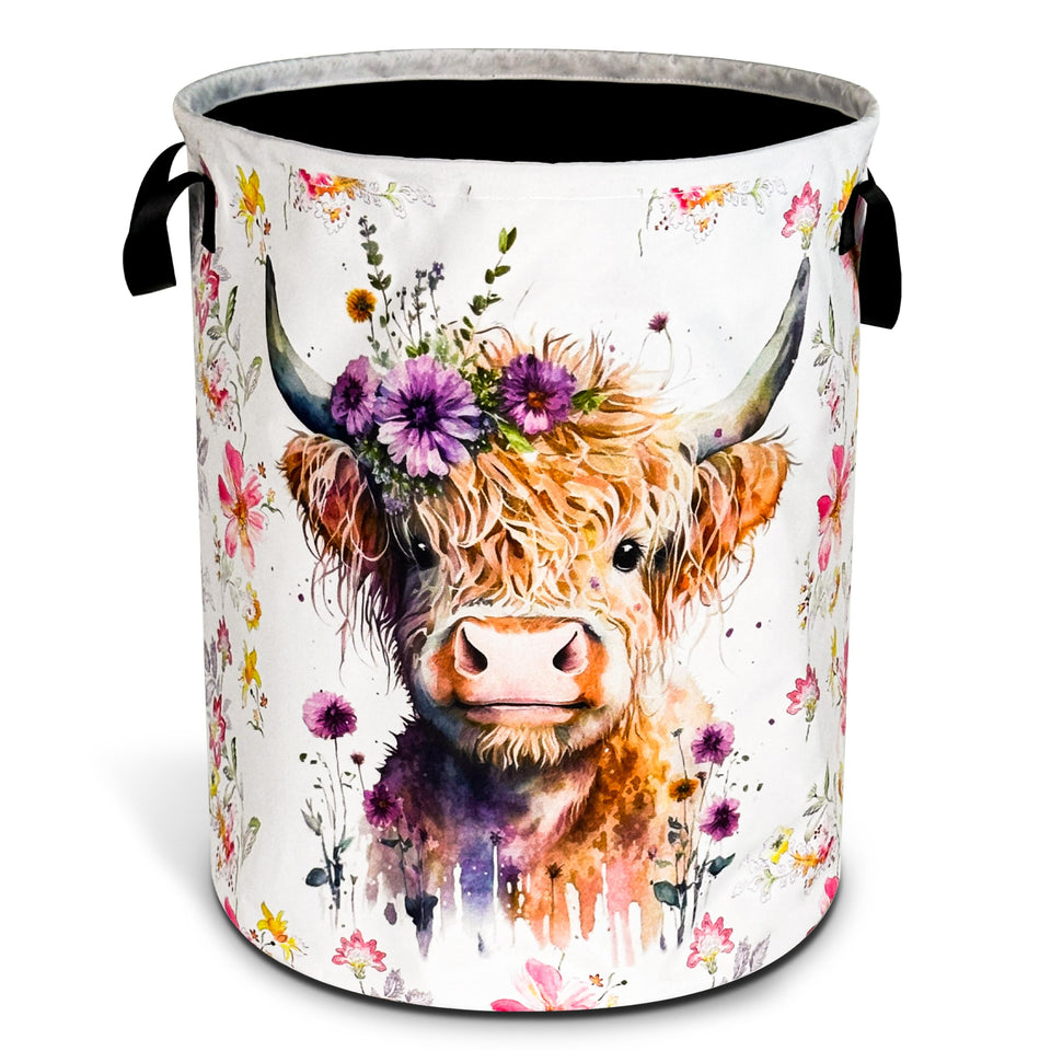 NUTAINLA Highland Cow laundry basket, front view, with sturdy handles for easy transport.