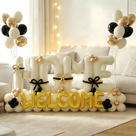 Nyvrexo ivory-black-gold latex balloons provide cohesive color for parties.