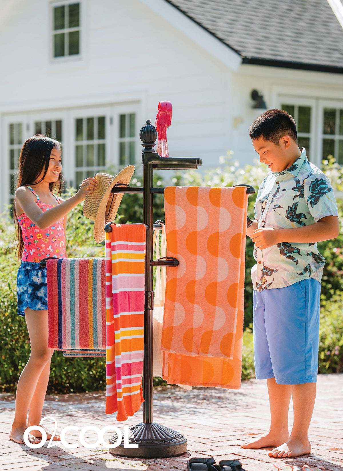 O2COOL Pool & Spa Valet bronze finish complements patio decor and towels at hand.