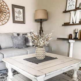 Oairse Vase on a coffee table with accents for everyday use