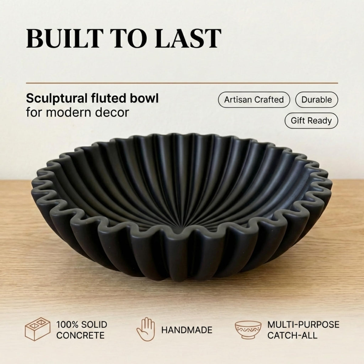 OAKOA concrete black bowl on counter showcasing versatile fruit and keys