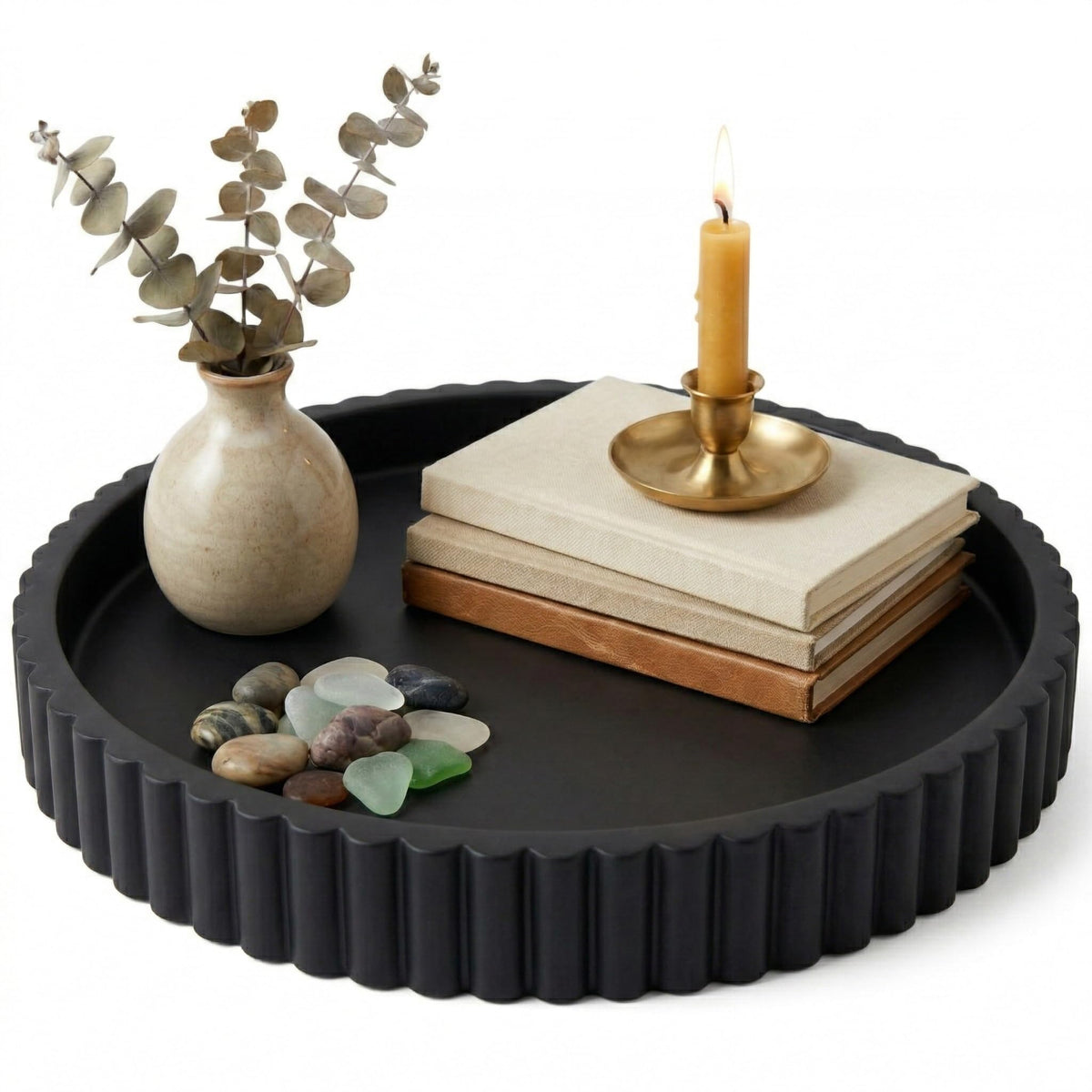 OAKOA concrete black round tray serves as a stylish coffee table centerpiece.