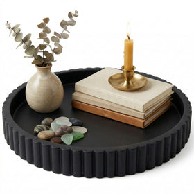OAKOA concrete black round tray serves as a stylish coffee table centerpiece.