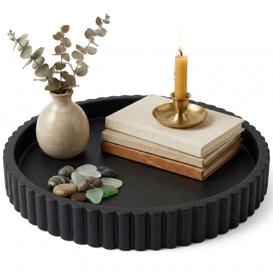 OAKOA concrete black round tray serves as a stylish coffee table centerpiece.