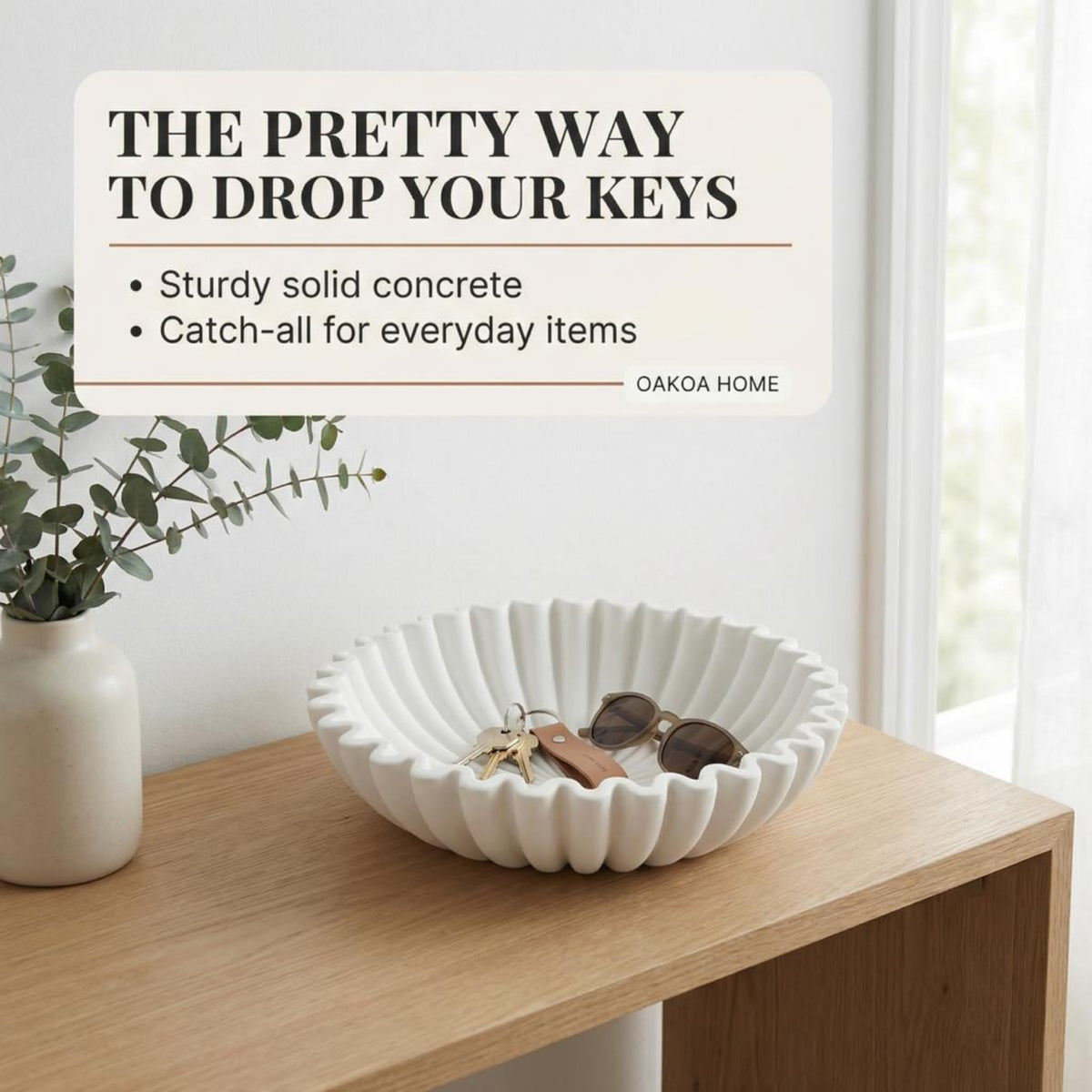 OAKOA minimalist white bowl pairs with neutral decor and displays fruits.