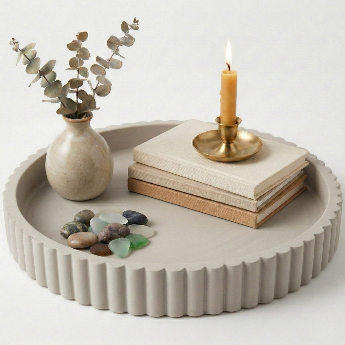 OAKOA round concrete tray on a coffee table used as a stylish centerpiece