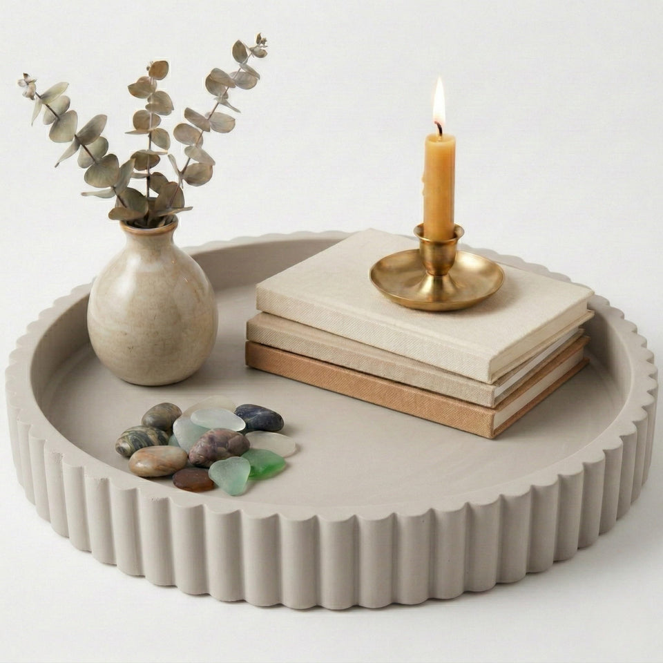 OAKOA round concrete tray on a coffee table used as a stylish centerpiece