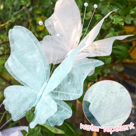 OBBOLO water-repellent paper butterflies designed for outdoor use in gardens.
