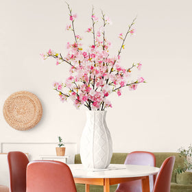 Obbsie cherry blossom branch used as a vase centerpiece