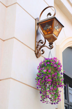 Obmnor artificial hanging flowers outdoors with UV-resistant silk petals for bright outdoor displays.