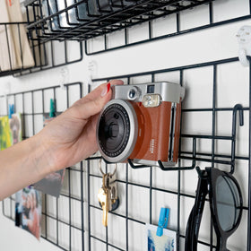 Odoxia grid panel assembly guide showing simple wall mounting