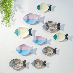 OECECR hand-carved wooden fish with depth and circular patterns.
