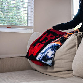 Official Godzilla kaiju-collectible throw adds iconic room appeal.