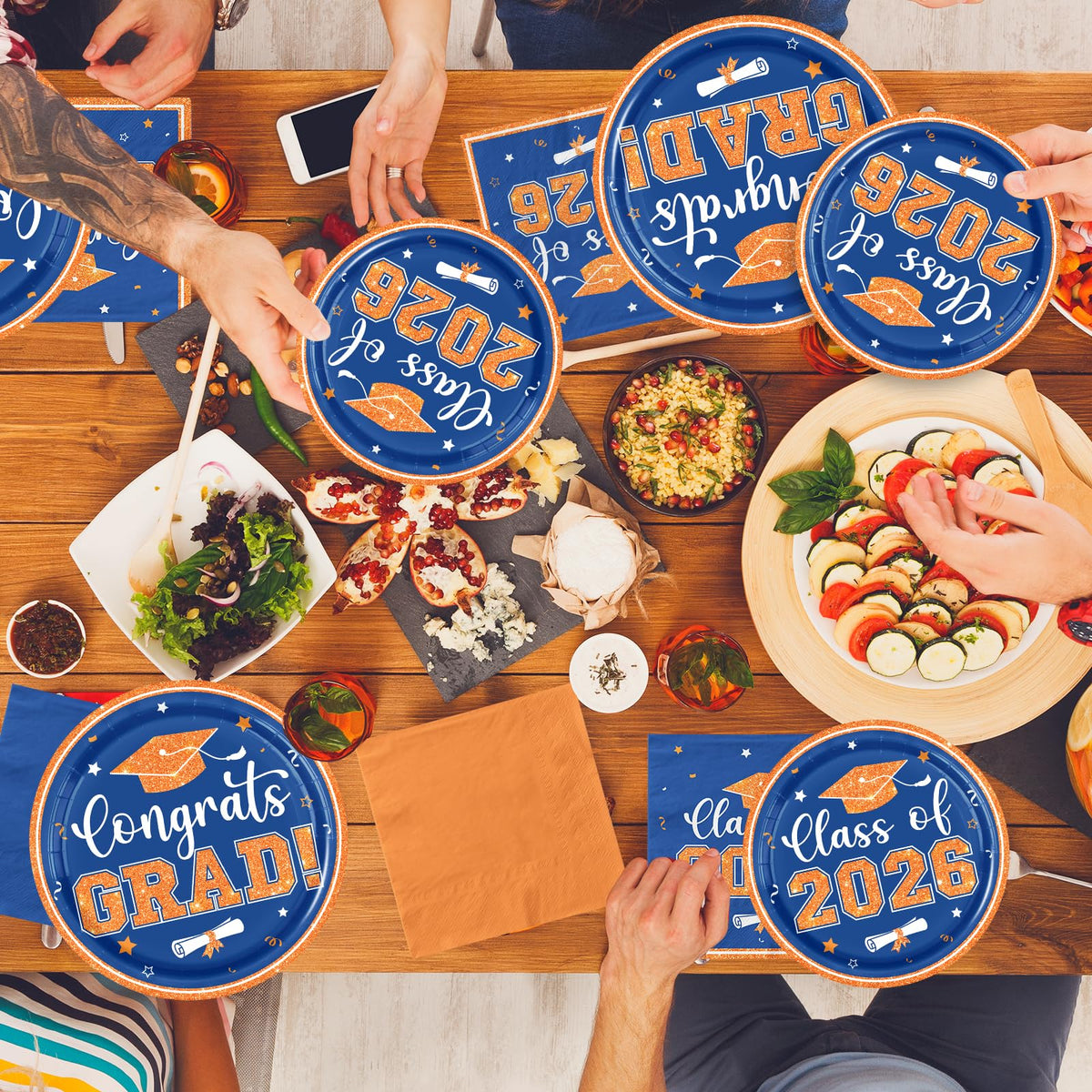 OGMOGKW graduation party setup ideas featuring orange and blue plates.