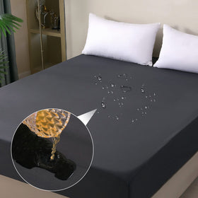 Ohano waterproof mattress protector top view showing snug queen fit and spill protection.