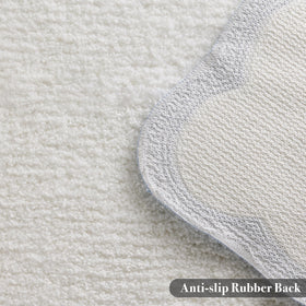 Ohocut blue scalloped piping bath rug adds a playful decor accent.