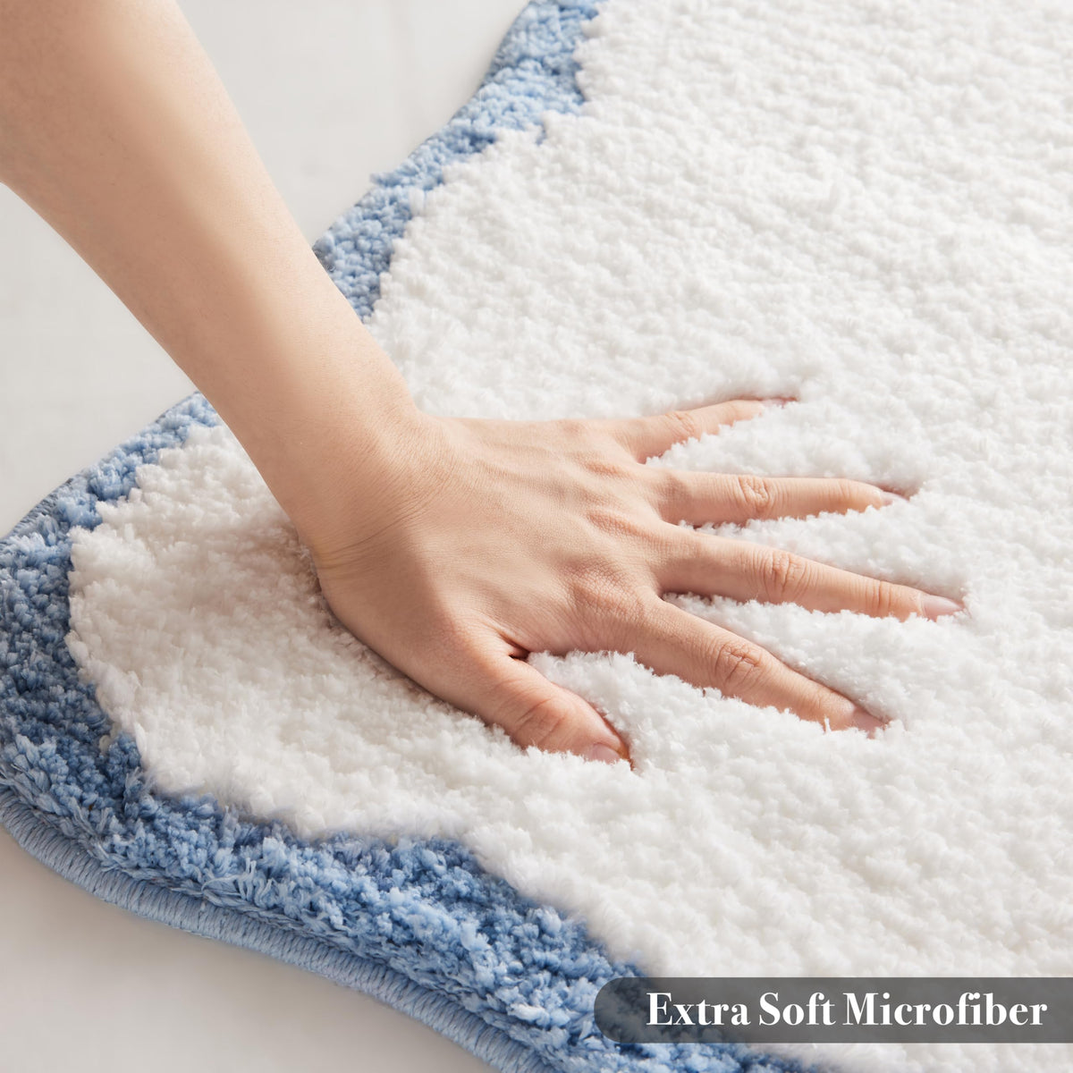 Ohocut white bath rug 32x20 complements modern bathroom layouts.
