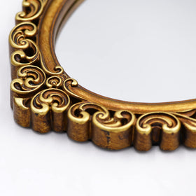 OIGUMR ornate gold oval wall mirror enhances classic decor.