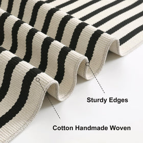OJIA black and cream striped rug adds timeless elegance to porches.