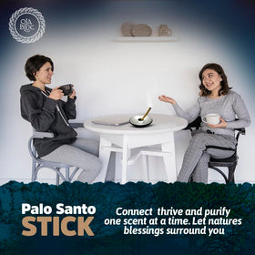 OLA BLUE Lighting and relighting Palo Santo sticks for extended aroma.