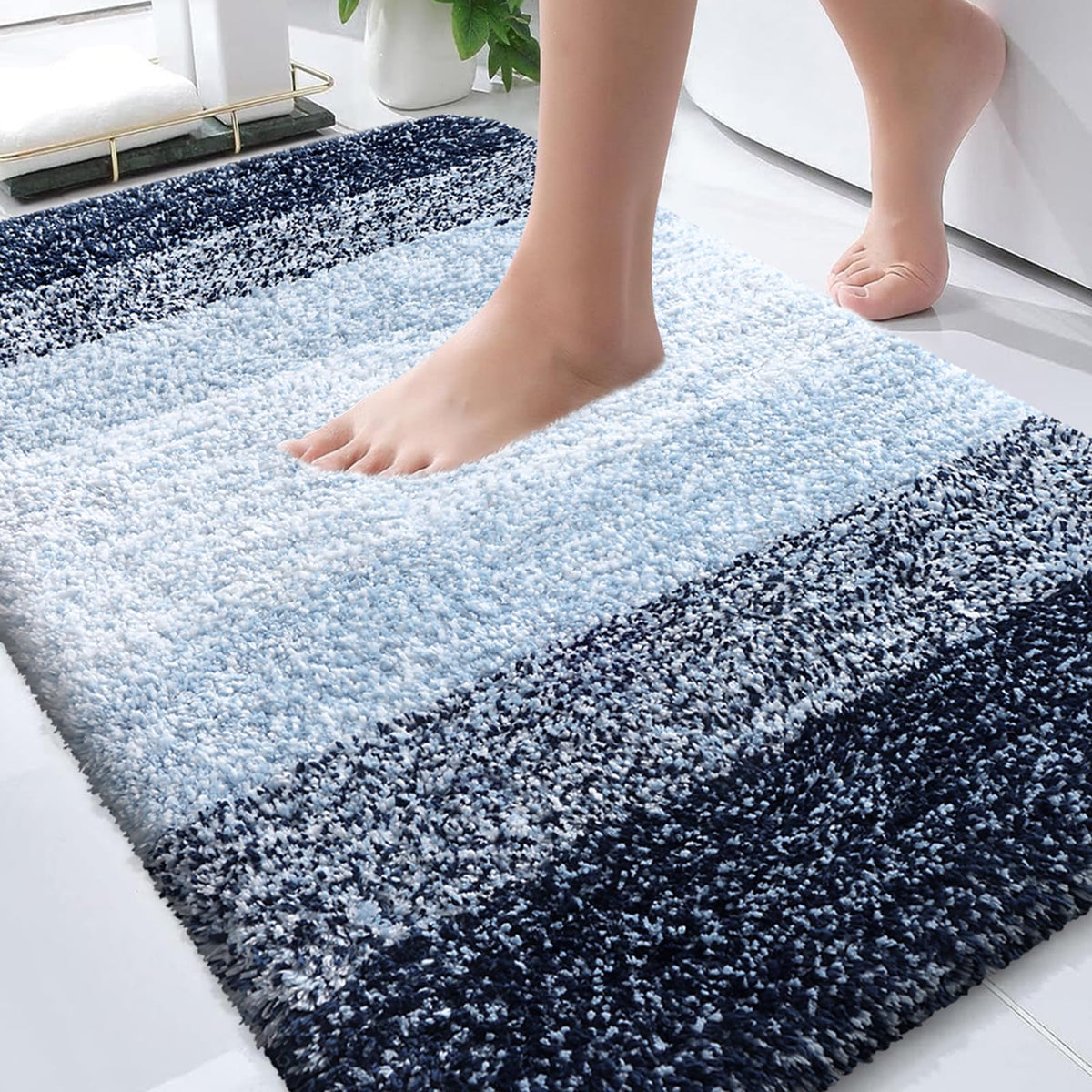 OLANLY bath rug 30x20 navy with gradient stripes enhances bathroom decor.
