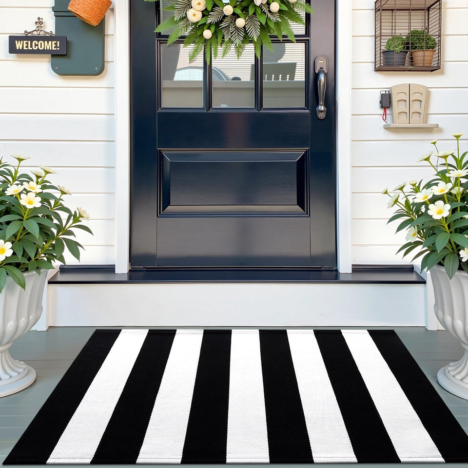 OLANLY black and white striped rug at front door for durable indoor-outdoor use.