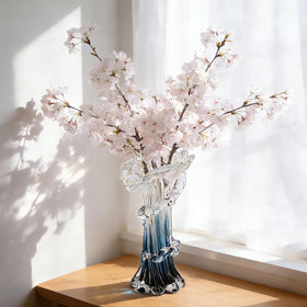 oliruim centerpiece blue glass vase serves as a striking table focal point.