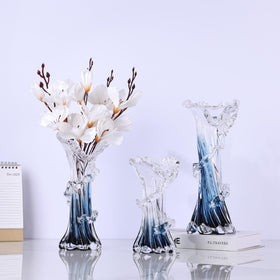 oliruim clear glass vase with blue swirls enhances light and airiness in rooms.