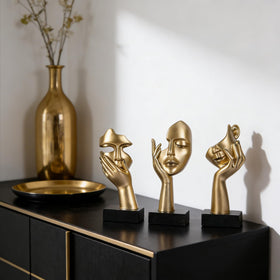 oliruim thinker's faces create bold accents on coffee tables
