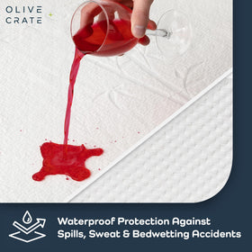 Olive + Crate deep-pocket queen fit securing protector around mattress