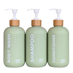 OLLIES shampoo dispenser front view in green for organized bathroom storage.
