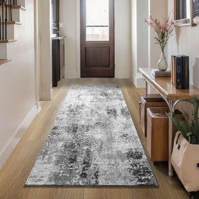Ompaa soft abstract rug adds warmth to living rooms or bedrooms.