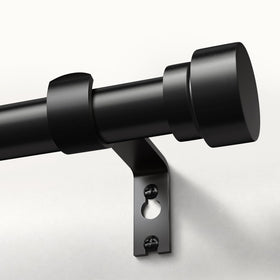 Oneach heavy-duty curtain rod set with 1-inch outer bars supports thick blackout drapes.