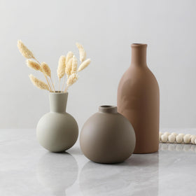 OOIT ceramic vases hold fresh flowers with a waterproof interior coating.