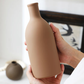 OOIT vase trio serves as a versatile dining table centerpiece option.