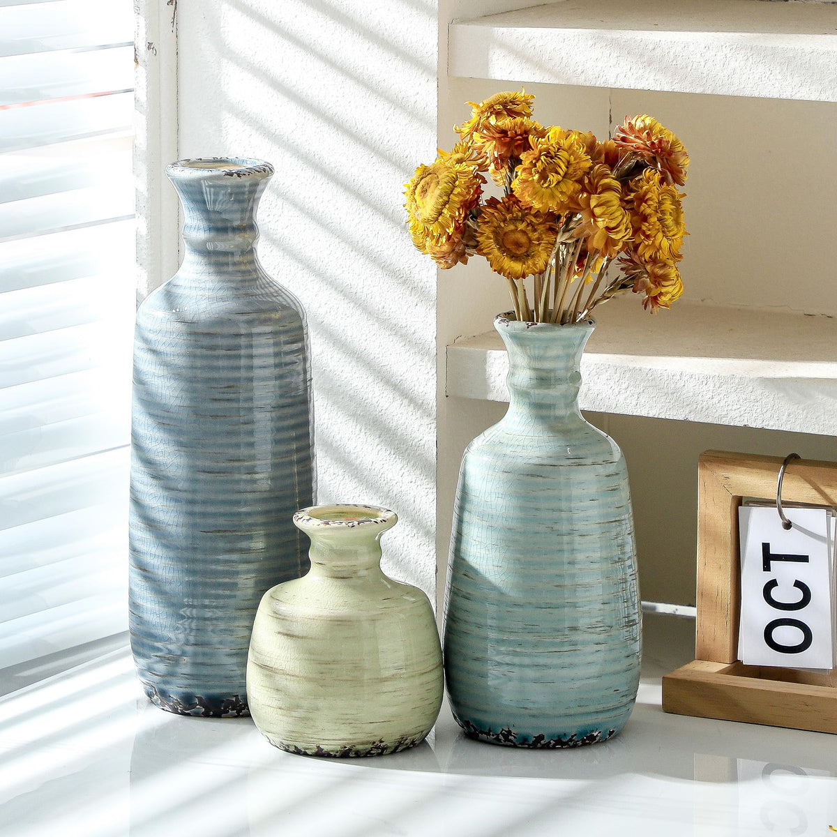 OOIT centerpieces with three vases for a cohesive mantel display