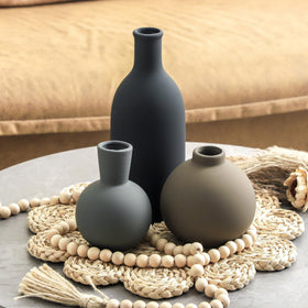 OOIT vases on a bookshelf create a refined decorative vignette.