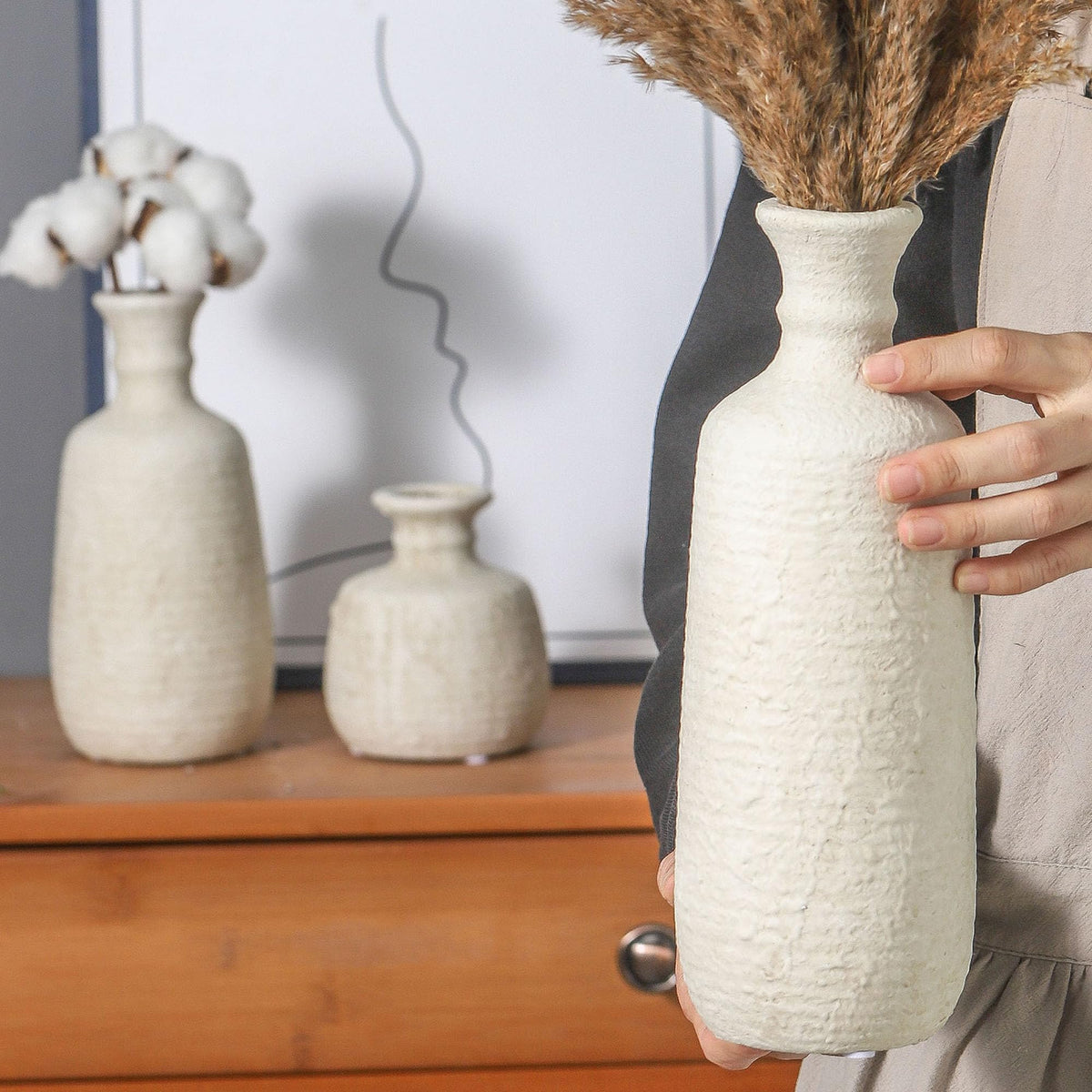 OOIT ceramic vases on bookshelf for balanced shelf styling