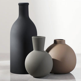 OOIT ceramic vase set of 3 in varied shapes enhances tabletop decor.
